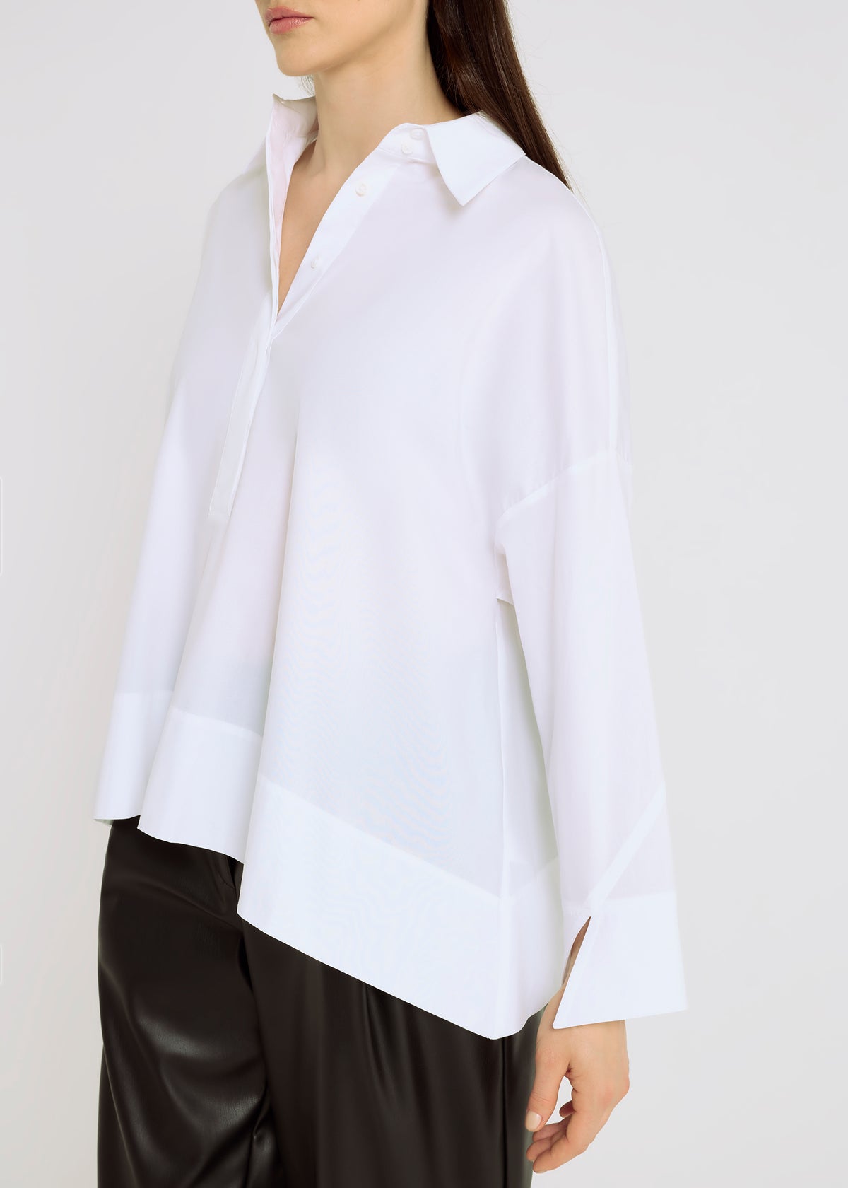 simone hana san white v-neck shirt with dropped hem and wide cuff sleeves