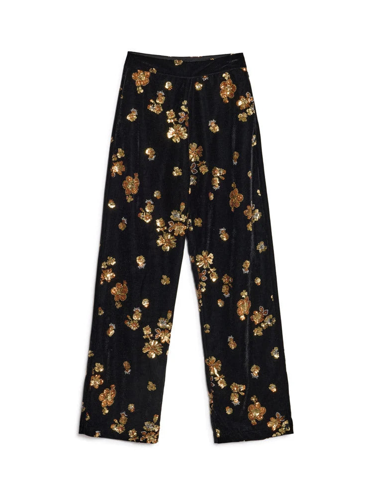 Black wide-leg trousers with an all-over metallic gold floral pattern, displayed flat against a solid white background.