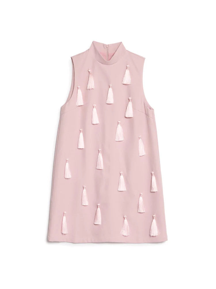 A sleeveless high-neck pink dress decorated with multiple small light pink tassels, shown flat against a plain white background.